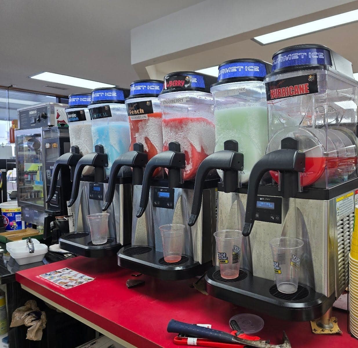 Six frozen drink machines lined up on the counter at Bent Creek Grocery